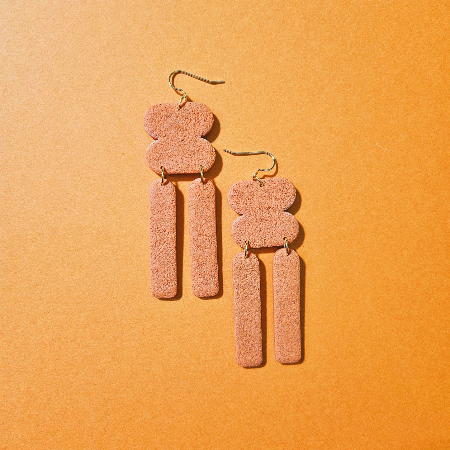 Rounded Shapes Dangly Earrings (textured orange)