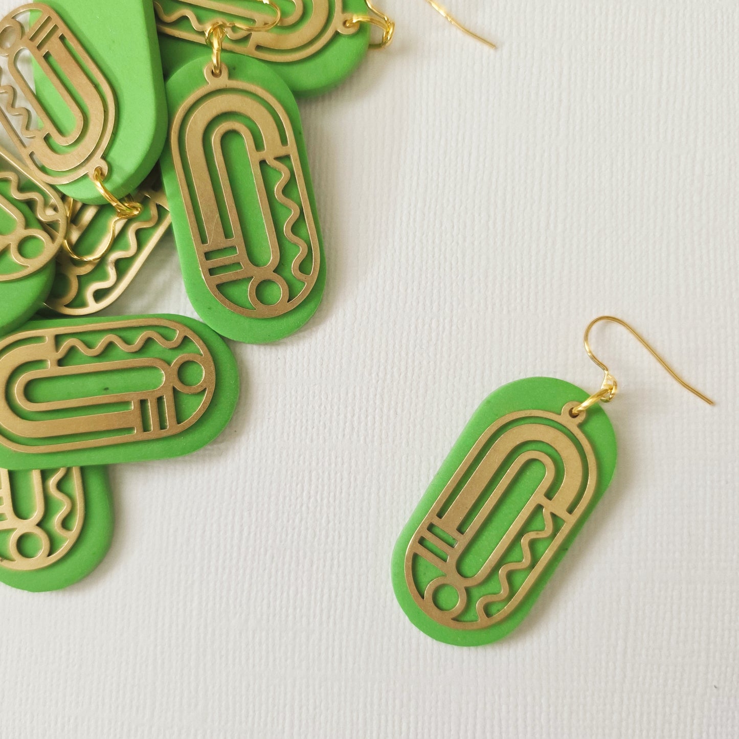 Green Ovals with Squiggle Brass Charm