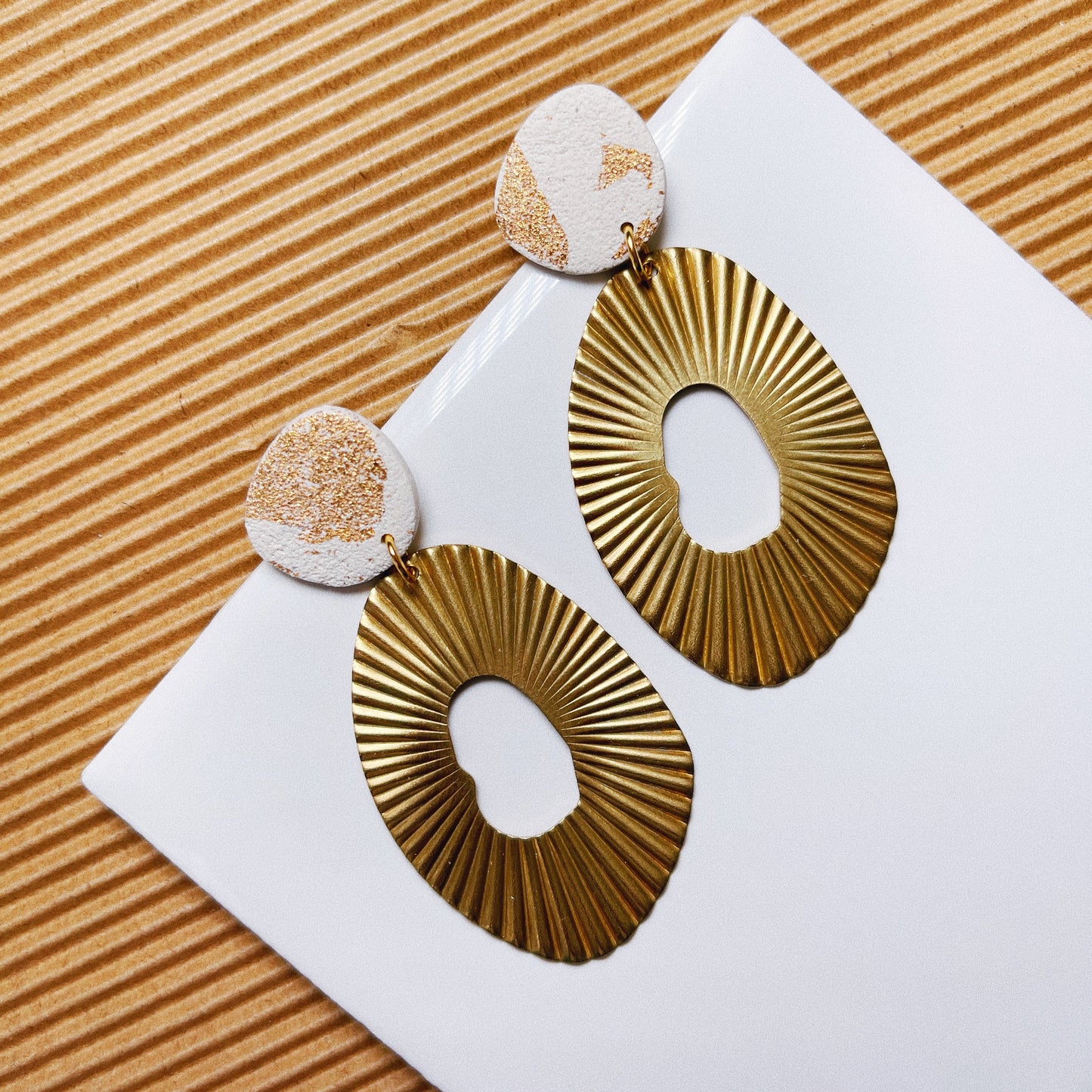Gold Sand Stud with Brass Charm